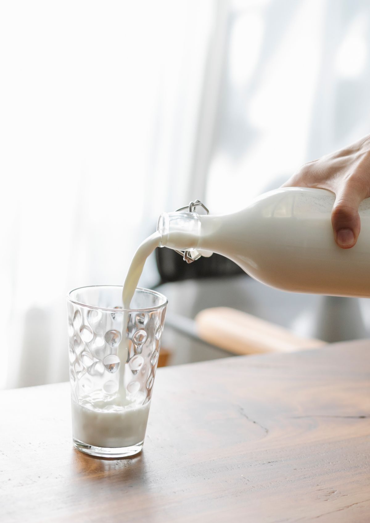 Milk being poured into a glass
